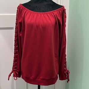 Venus off the shoulder women’s top. Burnt red/ burgundy color. Size M.